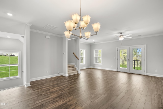 209 Broomgrove Way, Wake Forest, NC 27587 - unfurnished living room with dark wood-style flooring, stairs, baseboards, crown molding, and a chandelier