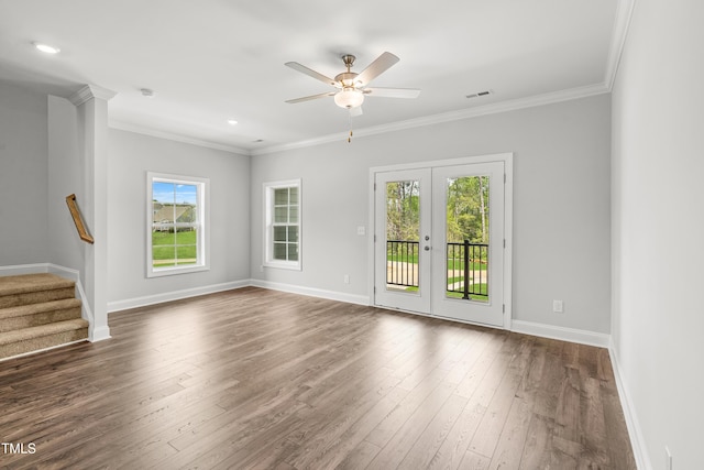 209 Broomgrove Way, Wake Forest, NC 27587 - unfurnished living room with baseboards, dark wood-style floors, stairs, ceiling fan, and crown molding