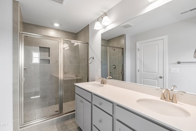 209 Broomgrove Way, Wake Forest, NC 27587 - full bathroom with a stall shower, double vanity, and tile patterned floors