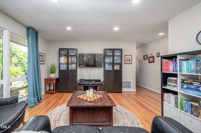 903 W Maynard Ave, Durham, NC 27704 - living room featuring light wood finished floors, recessed lighting, and baseboards