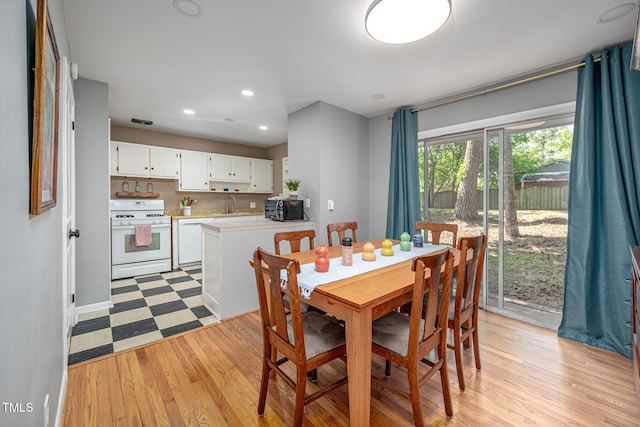 903 W Maynard Ave, Durham, NC 27704 - dining room featuring light wood-style floors and recessed lighting