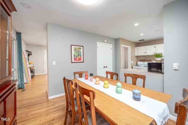 903 W Maynard Ave, Durham, NC 27704 - dining room with baseboards, light wood-style floors, and recessed lighting