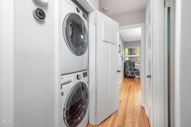 903 W Maynard Ave, Durham, NC 27704 - laundry area with stacked washer and clothes dryer and light wood-style floors