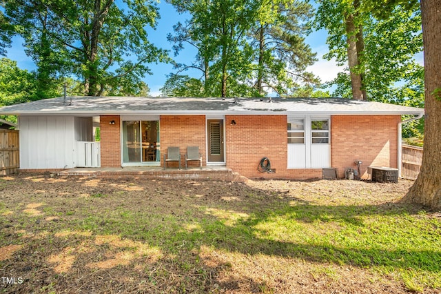 903 W Maynard Ave, Durham, NC 27704 - back of house with brick siding and central AC unit