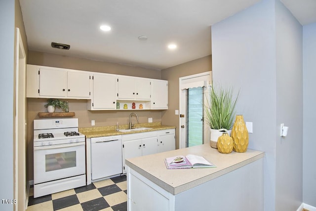 903 W Maynard Ave, Durham, NC 27704 - kitchen with white appliances, light floors, white cabinets, open shelves, and recessed lighting