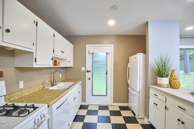 903 W Maynard Ave, Durham, NC 27704 - kitchen featuring white appliances, tile patterned floors, white cabinets, light countertops, and recessed lighting