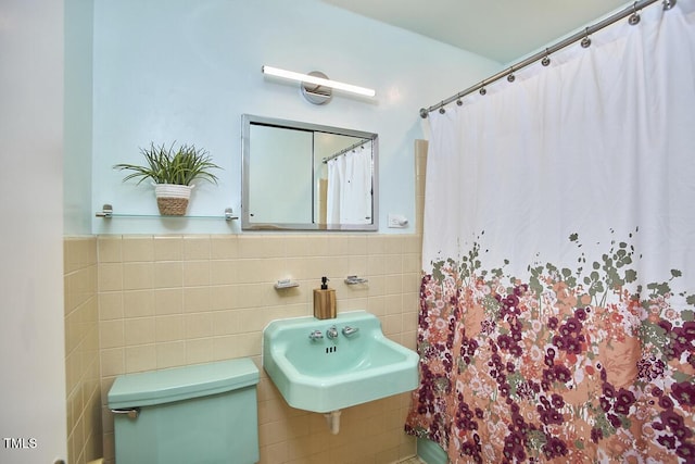 903 W Maynard Ave, Durham, NC 27704 - full bathroom featuring tile walls, a shower with shower curtain, and wainscoting