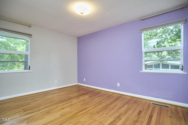 903 W Maynard Ave, Durham, NC 27704 - spare room with baseboards and light wood finished floors