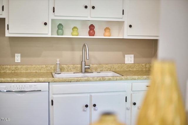 903 W Maynard Ave, Durham, NC 27704 - kitchen featuring white dishwasher, open shelves, and white cabinetry
