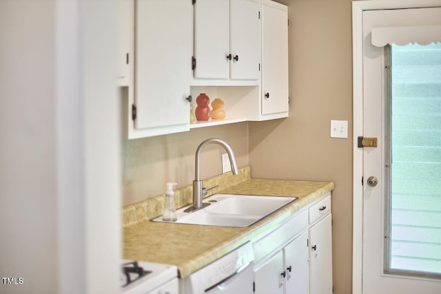903 W Maynard Ave, Durham, NC 27704 - kitchen featuring light countertops, white appliances, and white cabinetry