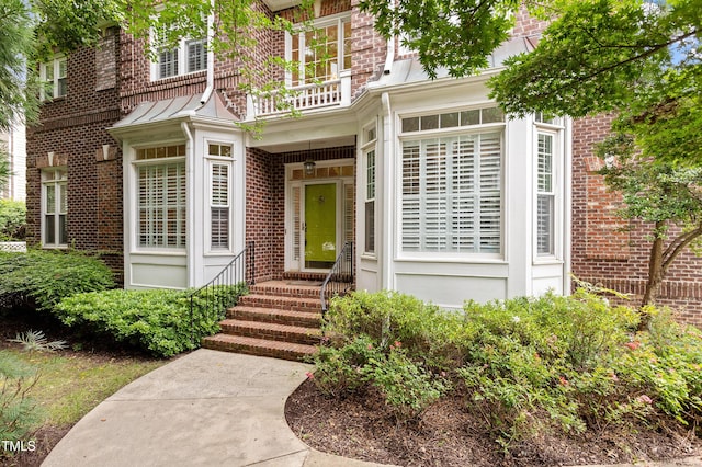 3928 Bentley Bridge Rd, Raleigh, NC 27612 - view of exterior entry featuring brick siding
