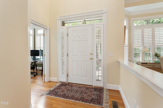 3928 Bentley Bridge Rd, Raleigh, NC 27612 - entryway featuring wood finished floors, healthy amount of natural light, and baseboards