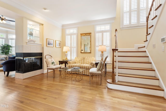 3928 Bentley Bridge Rd, Raleigh, NC 27612 - living area featuring crown molding, stairway, baseboards, and light wood-type flooring