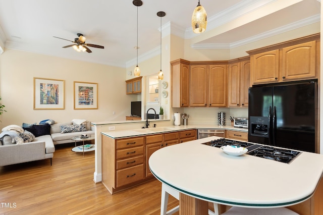 3928 Bentley Bridge Rd, Raleigh, NC 27612 - kitchen featuring black fridge with ice dispenser, a sink, open floor plan, a ceiling fan, and a peninsula
