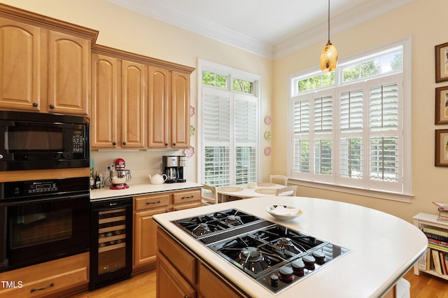 3928 Bentley Bridge Rd, Raleigh, NC 27612 - kitchen featuring black appliances, beverage cooler, light countertops, decorative light fixtures, and light wood-style floors