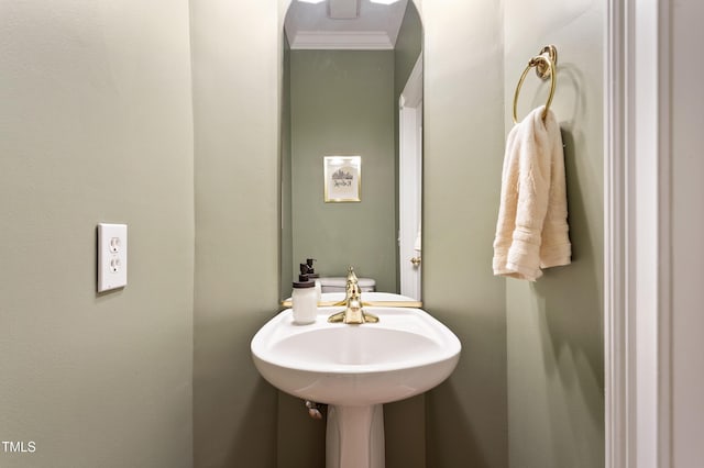 3928 Bentley Bridge Rd, Raleigh, NC 27612 - half bath featuring crown molding and a sink
