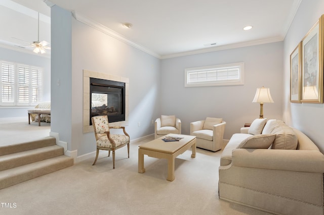 3928 Bentley Bridge Rd, Raleigh, NC 27612 - carpeted living room featuring a ceiling fan, healthy amount of natural light, ornamental molding, a fireplace, and baseboards