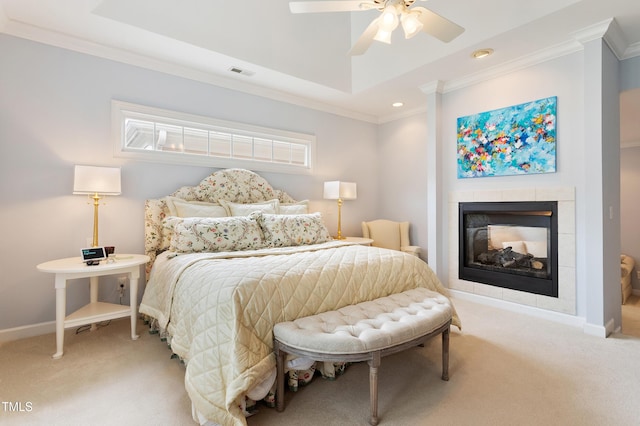 3928 Bentley Bridge Rd, Raleigh, NC 27612 - bedroom with crown molding, light colored carpet, a tiled fireplace, baseboards, and multiple windows
