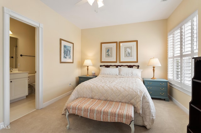 3928 Bentley Bridge Rd, Raleigh, NC 27612 - bedroom featuring light carpet, ensuite bathroom, baseboards, and a ceiling fan