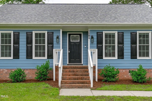 5804 Heathill Ct, Raleigh, NC 27603 - doorway to property featuring a shingled roof
