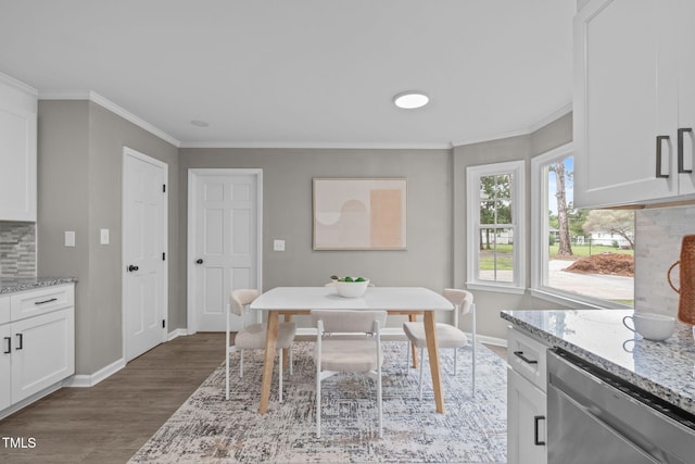 5804 Heathill Ct, Raleigh, NC 27603 - dining space featuring wood finished floors, baseboards, and ornamental molding