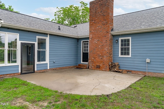 5804 Heathill Ct, Raleigh, NC 27603 - back of property with a patio area, a chimney, and roof with shingles