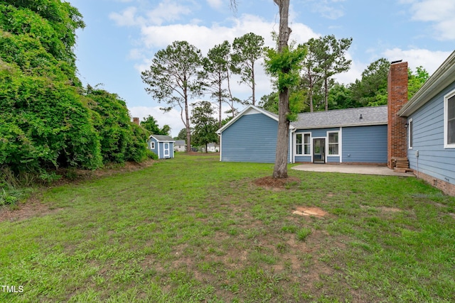 5804 Heathill Ct, Raleigh, NC 27603 - view of grassy yard with a patio area and an outdoor structure