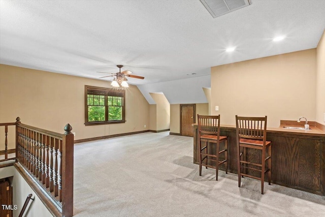 5125 Penny Rd, Raleigh, NC 27606 - dining area featuring light carpet, a ceiling fan, recessed lighting, and vaulted ceiling