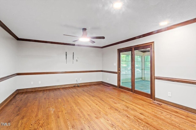 5125 Penny Rd, Raleigh, NC 27606 - empty room with wood finished floors, a ceiling fan, and ornamental molding