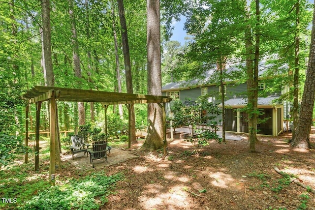 5125 Penny Rd, Raleigh, NC 27606 - view of yard with a sunroom and a deck