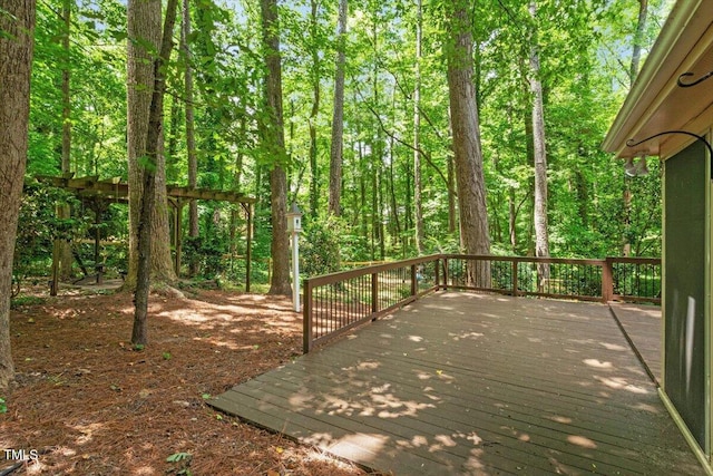 5125 Penny Rd, Raleigh, NC 27606 - wooden deck with a wooded view