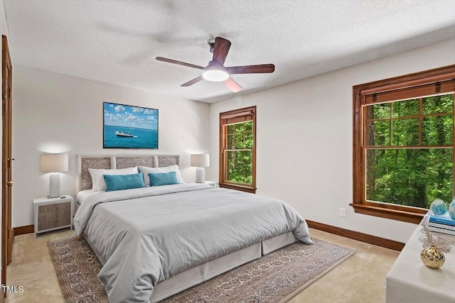 5125 Penny Rd, Raleigh, NC 27606 - bedroom featuring a textured ceiling, a ceiling fan, and light carpet