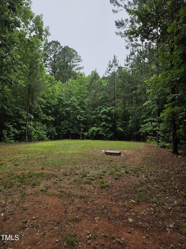 210 Sorrel Dr, Franklinton, NC 27525 - view of yard with a wooded view