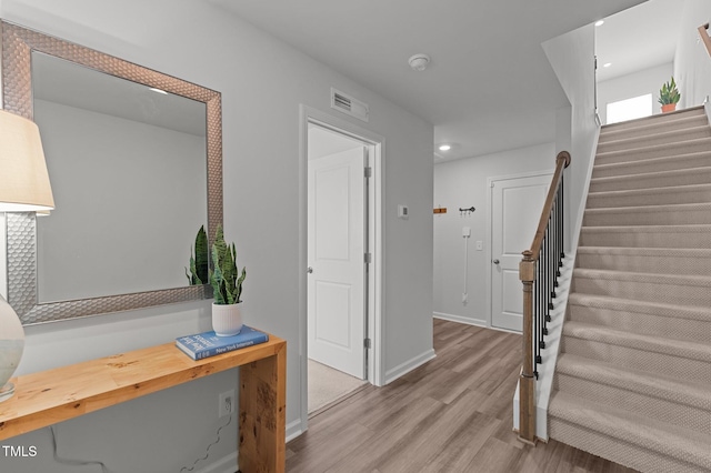 6415 Mentor Pl, Raleigh, NC 27616 - stairway featuring wood finished floors, recessed lighting, and baseboards