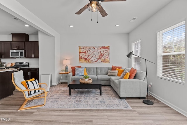 6415 Mentor Pl, Raleigh, NC 27616 - living room featuring ceiling fan, light wood-style floors, recessed lighting, and baseboards