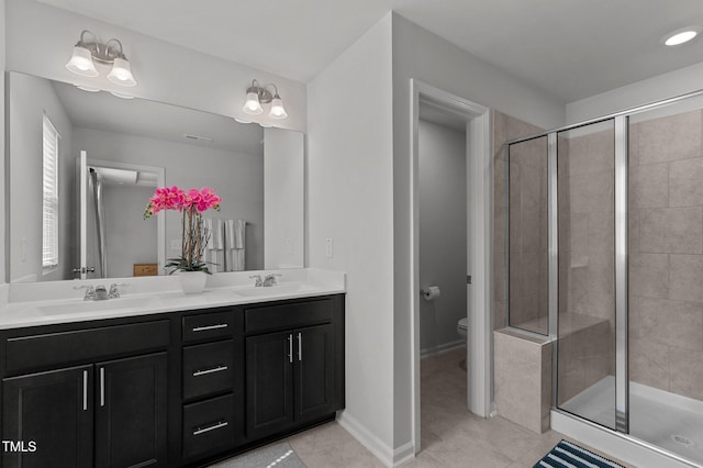 6415 Mentor Pl, Raleigh, NC 27616 - bathroom featuring tile patterned floors, double vanity, toilet, and a stall shower