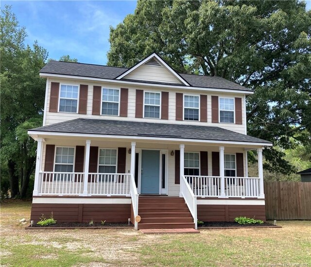 526 E Stack St, Saint Pauls, NC 28384 - view of front of home with covered porch and a shingled roof