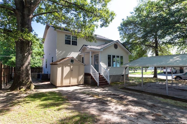 526 E Stack St, Saint Pauls, NC 28384 - view of front of home featuring a carport, cooling unit, and crawl space