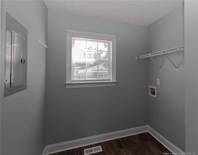 526 E Stack St, Saint Pauls, NC 28384 - laundry area with washer hookup, dark wood finished floors, electric panel, and baseboards