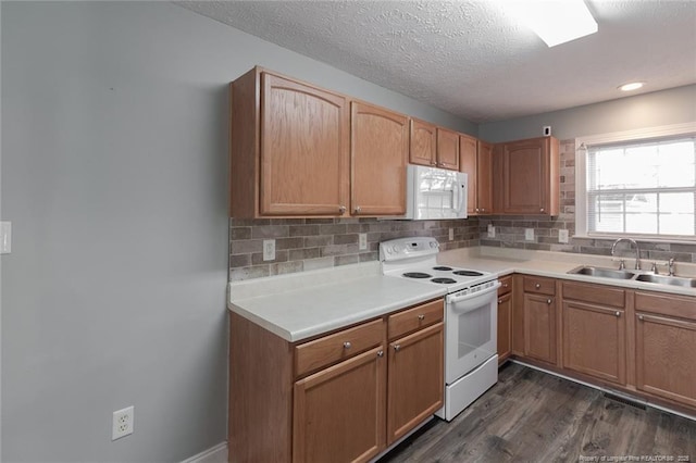 526 E Stack St, Saint Pauls, NC 28384 - kitchen featuring white appliances, a sink, decorative backsplash, light countertops, and a textured ceiling