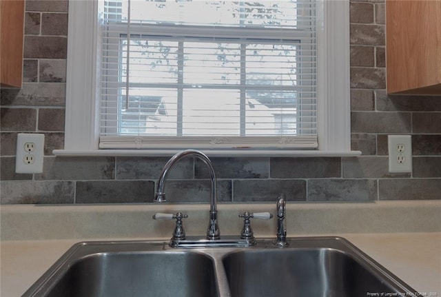 526 E Stack St, Saint Pauls, NC 28384 - kitchen view of a sink, tasteful backsplash, and light countertops