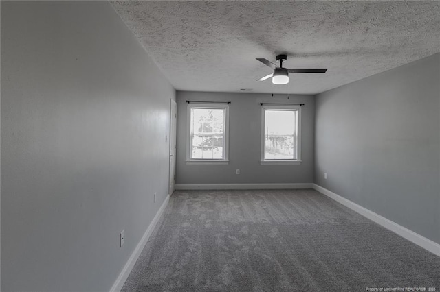 526 E Stack St, Saint Pauls, NC 28384 - spare room featuring ceiling fan, carpet, a textured ceiling, and baseboards