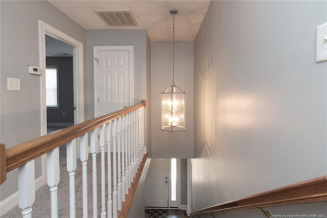 526 E Stack St, Saint Pauls, NC 28384 - staircase with baseboards and a chandelier
