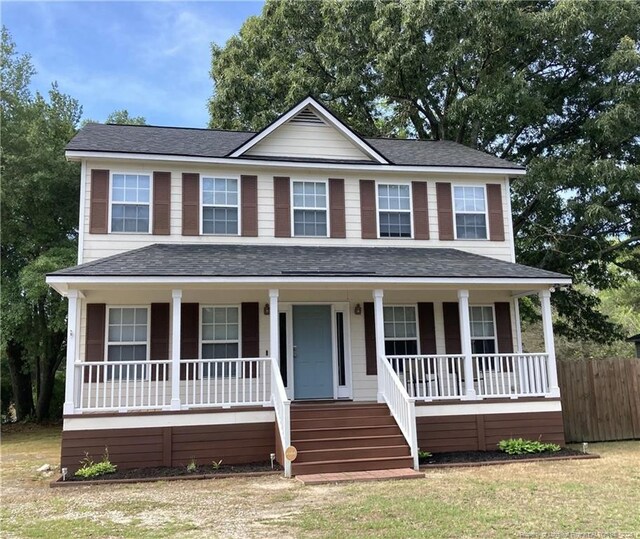 526 E Stack St, Saint Pauls, NC 28384 - view of front facade with covered porch and roof with shingles
