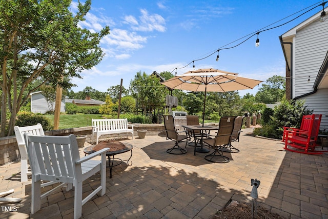 2127 Somers Ave, Burlington, NC 27215 - view of patio featuring outdoor dining space and a fire pit