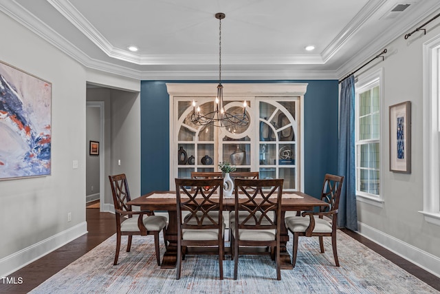200 Baskerville Ct, Holly Springs, NC 27540 - dining room with a chandelier, wood finished floors, and ornamental molding