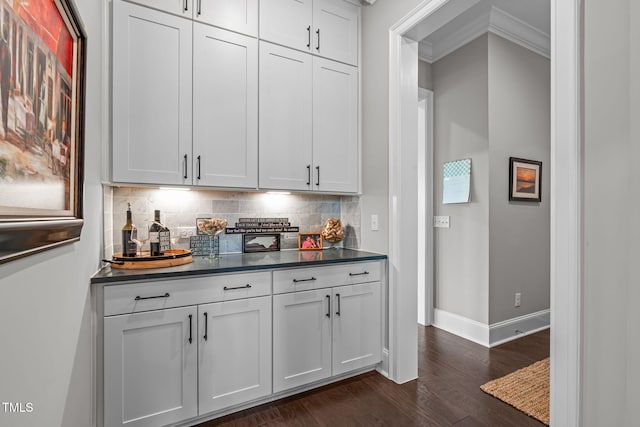 200 Baskerville Ct, Holly Springs, NC 27540 - indoor dry bar with dark wood-type flooring, backsplash, and crown molding