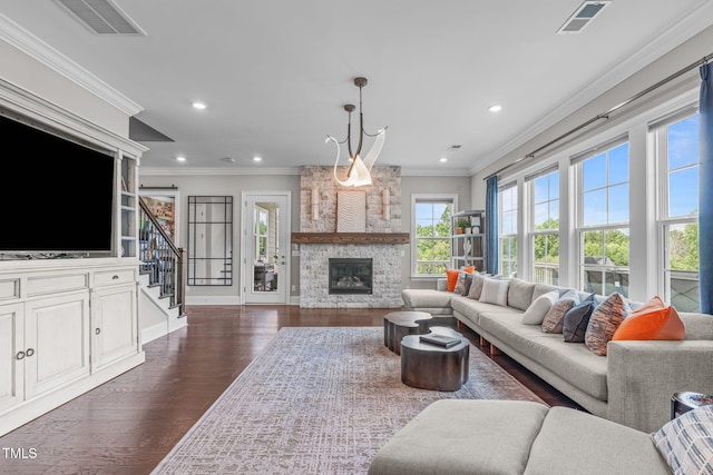 200 Baskerville Ct, Holly Springs, NC 27540 - living room with dark wood-style flooring, stairway, a stone fireplace, ornamental molding, and recessed lighting