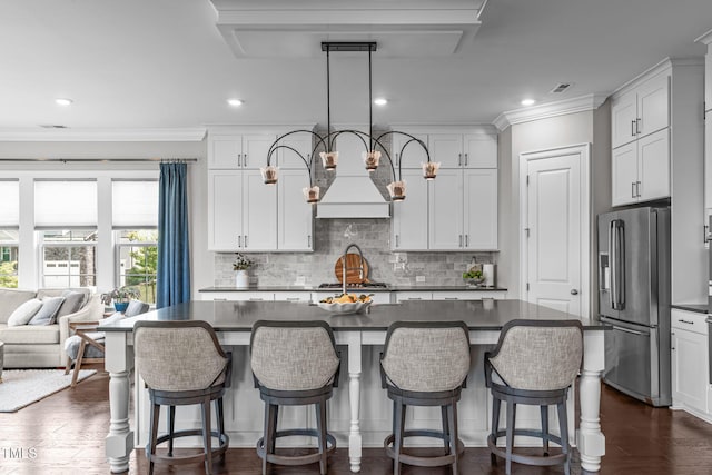 200 Baskerville Ct, Holly Springs, NC 27540 - kitchen featuring stainless steel appliances, dark countertops, backsplash, dark wood-style flooring, and ornamental molding