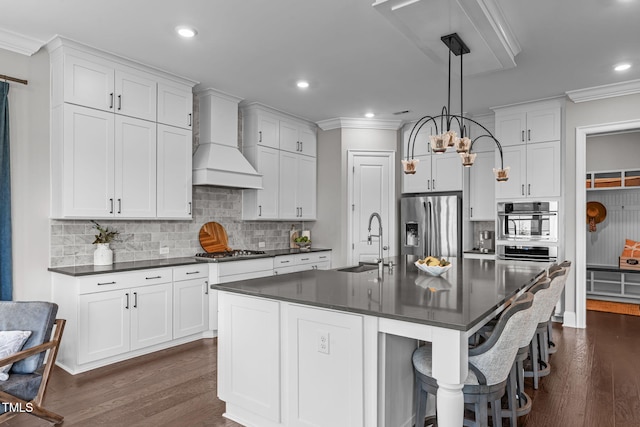 200 Baskerville Ct, Holly Springs, NC 27540 - kitchen featuring dark countertops, custom exhaust hood, ornamental molding, stainless steel appliances, and decorative backsplash